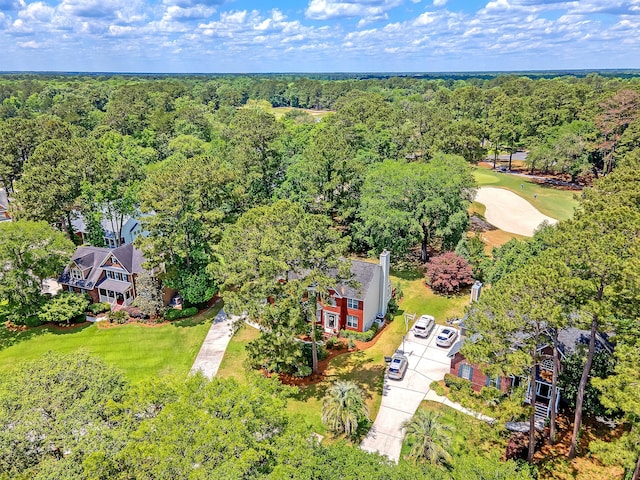 bird's eye view of a forest and a local golf course