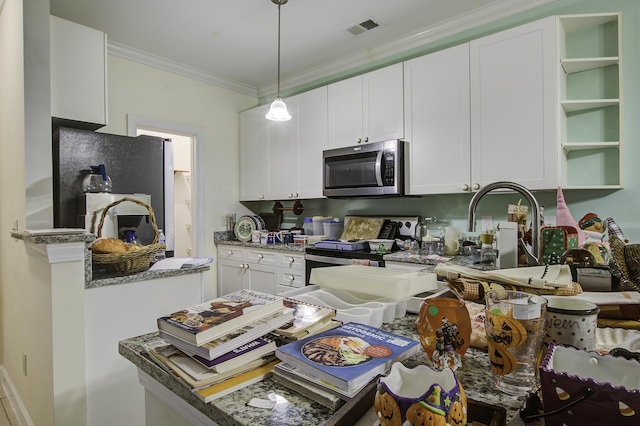 kitchen with white cabinetry, dark stone counters, and appliances with stainless steel finishes