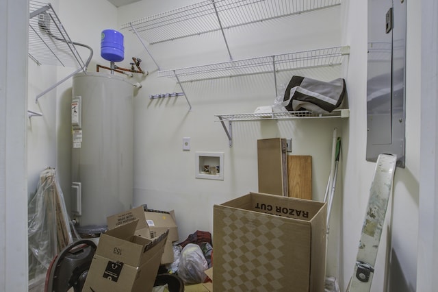 laundry area with hookup for a washing machine and electric water heater