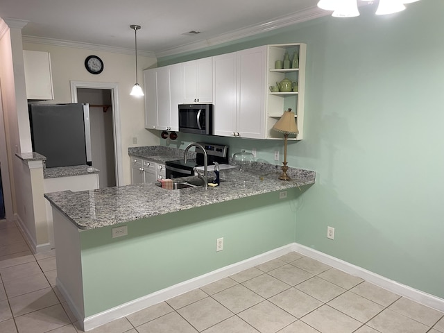 kitchen with decorative light fixtures, white cabinets, ornamental molding, kitchen peninsula, and stainless steel appliances