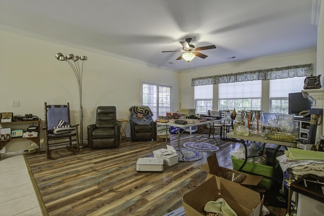 living room featuring hardwood / wood-style flooring, ornamental molding, and ceiling fan