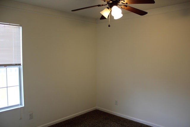 carpeted empty room featuring ceiling fan and ornamental molding