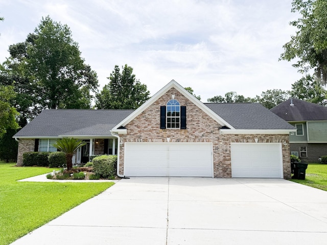 1804 Bass Rd, Moncks Corner, SC 29461 - view of front of house with an attached garage, a front yard, driveway, and brick siding