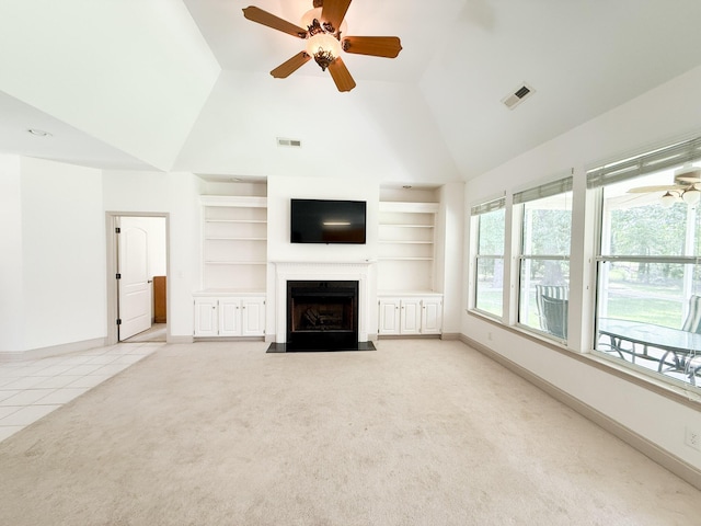 1804 Bass Rd, Moncks Corner, SC 29461 - unfurnished living room with ceiling fan, built in shelves, a fireplace with flush hearth, light colored carpet, and light tile patterned floors
