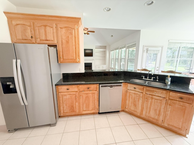 1804 Bass Rd, Moncks Corner, SC 29461 - kitchen featuring appliances with stainless steel finishes, ceiling fan, a fireplace, vaulted ceiling, and dark stone countertops