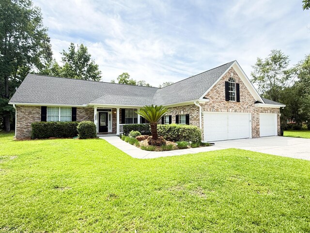 1804 Bass Rd, Moncks Corner, SC 29461 - view of front of home with driveway, a front yard, roof with shingles, a porch, and brick siding