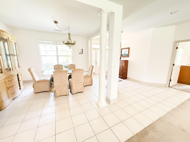 1804 Bass Rd, Moncks Corner, SC 29461 - dining space with a chandelier, light tile patterned floors, and ornate columns