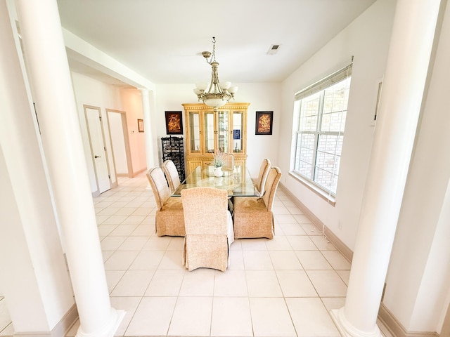 1804 Bass Rd, Moncks Corner, SC 29461 - dining space featuring ornate columns, light tile patterned floors, and a chandelier