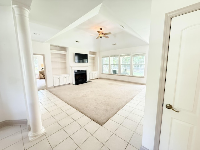 1804 Bass Rd, Moncks Corner, SC 29461 - unfurnished living room featuring ornate columns, light carpet, light tile patterned floors, built in shelves, and ceiling fan