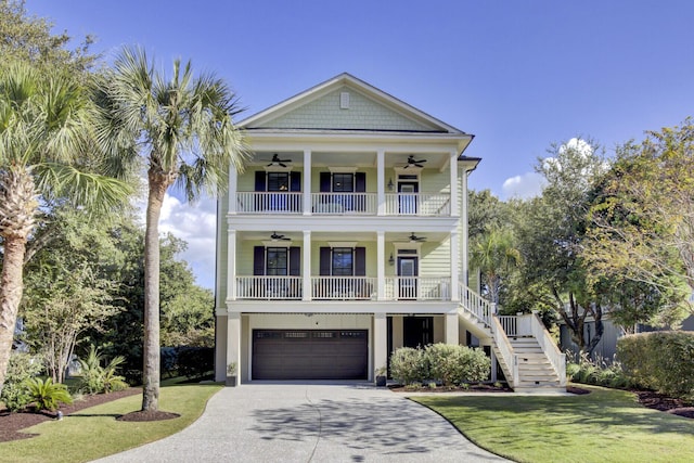 828 Bridge Point Cir, Mount Pleasant, SC 29464 - view of front of home with ceiling fan, stairs, driveway, an attached garage, and a porch