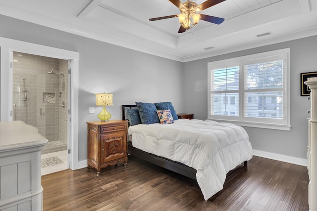 828 Bridge Point Cir, Mount Pleasant, SC 29464 - bedroom featuring a tray ceiling, dark wood-type flooring, ornamental molding, baseboards, and ensuite bath