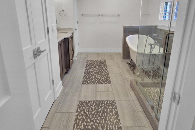 828 Bridge Point Cir, Mount Pleasant, SC 29464 - bathroom featuring vanity, a freestanding tub, a shower stall, and tile patterned floors