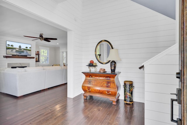 828 Bridge Point Cir, Mount Pleasant, SC 29464 - living room featuring wood finished floors, a ceiling fan, a fireplace, and wooden walls