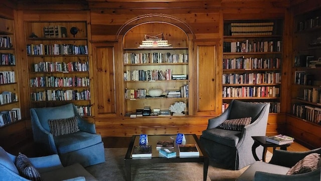 sitting room featuring bookshelves