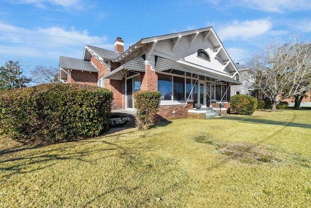 view of home's exterior with a yard