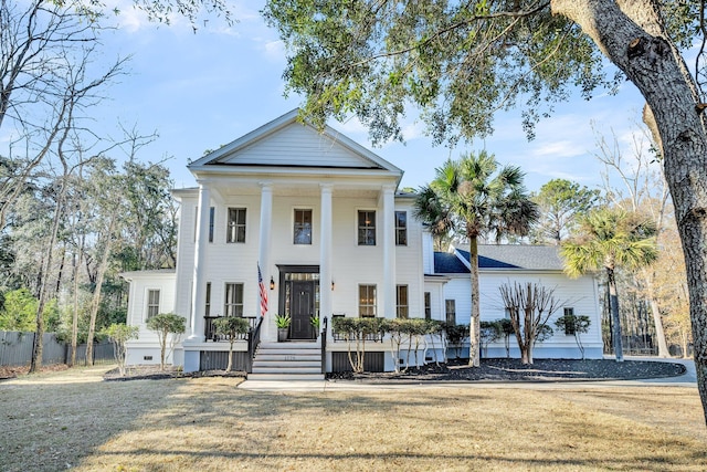 greek revival inspired property with a front lawn