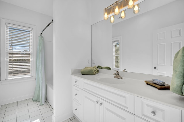 bathroom with vanity, tile patterned floors, and a wealth of natural light