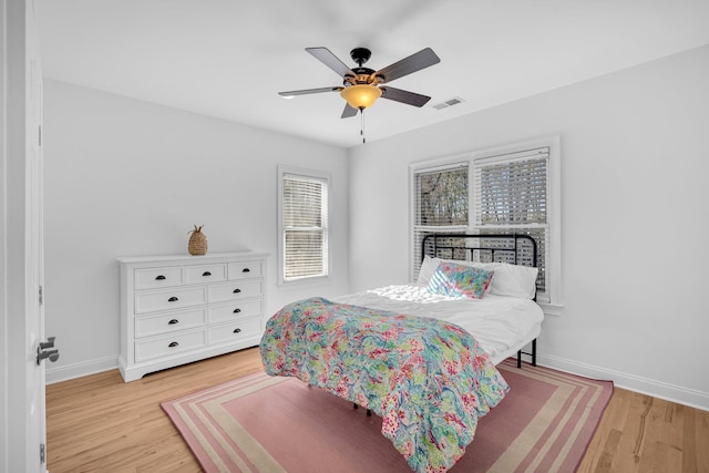 bedroom featuring ceiling fan and light hardwood / wood-style floors