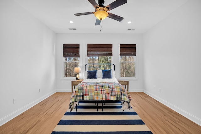 bedroom featuring ceiling fan and hardwood / wood-style floors