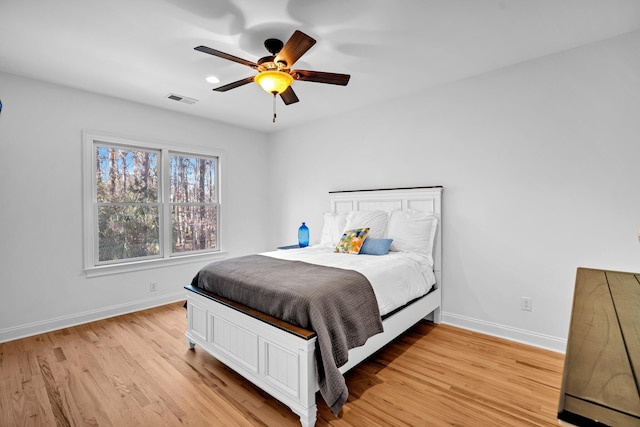 bedroom featuring ceiling fan and light hardwood / wood-style flooring