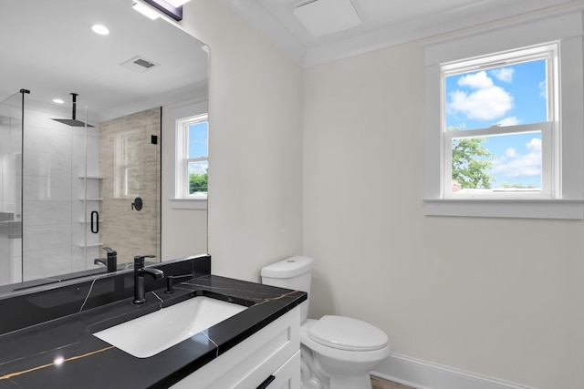 bathroom featuring a stall shower, vanity, toilet, recessed lighting, and baseboards