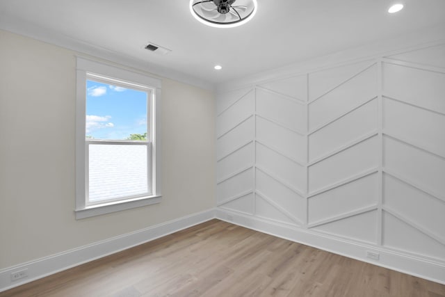 unfurnished room featuring light wood-type flooring, baseboards, and recessed lighting