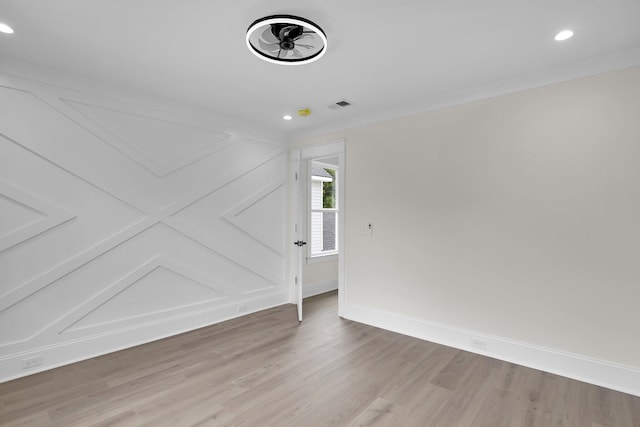 unfurnished room with light wood-style floors, recessed lighting, and baseboards