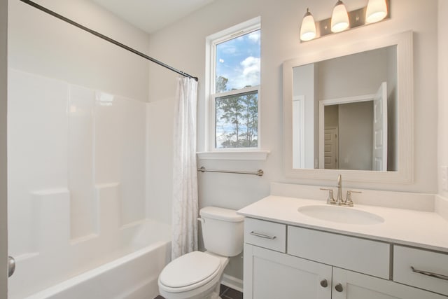 bathroom featuring shower / tub combo, vanity, and toilet