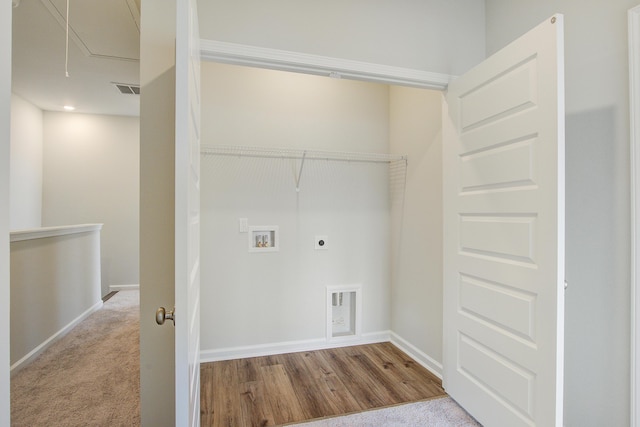 laundry area with laundry area, attic access, baseboards, hookup for an electric dryer, and washer hookup