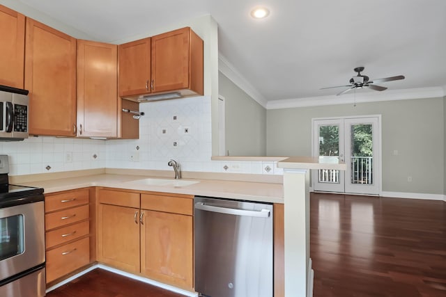 1604 Basildon Rd, Mount Pleasant, SC 29466 - kitchen with stainless steel appliances, ornamental molding, a ceiling fan, light countertops, and dark wood finished floors