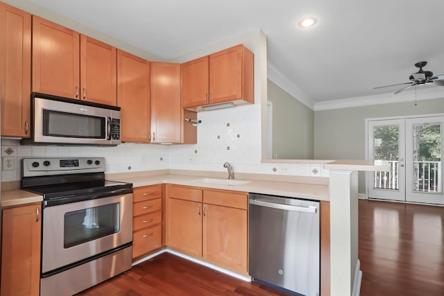 1604 Basildon Rd, Mount Pleasant, SC 29466 - kitchen featuring stainless steel appliances, dark wood finished floors, ornamental molding, light countertops, and a ceiling fan
