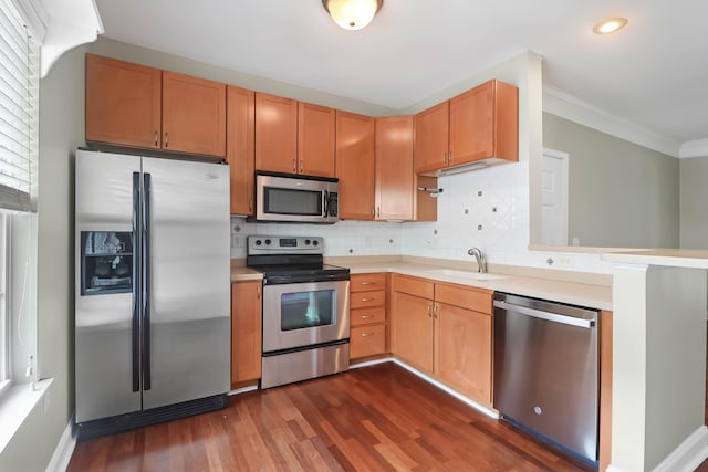 1604 Basildon Rd, Mount Pleasant, SC 29466 - kitchen featuring appliances with stainless steel finishes, dark wood-style flooring, light countertops, recessed lighting, and decorative backsplash