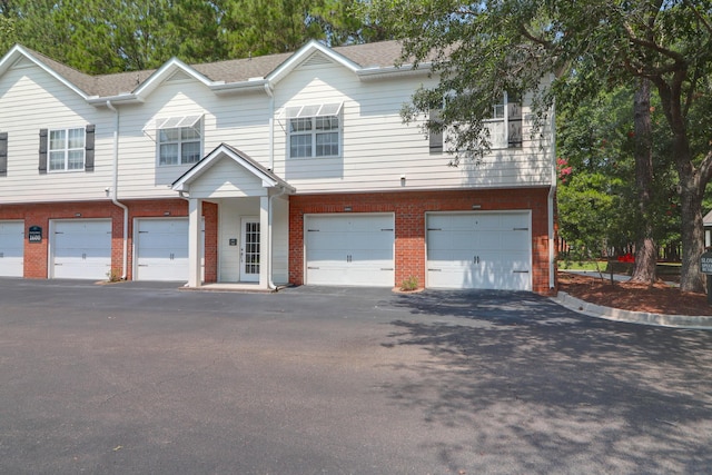1604 Basildon Rd, Mount Pleasant, SC 29466 - townhome / multi-family property with brick siding, a garage, and driveway