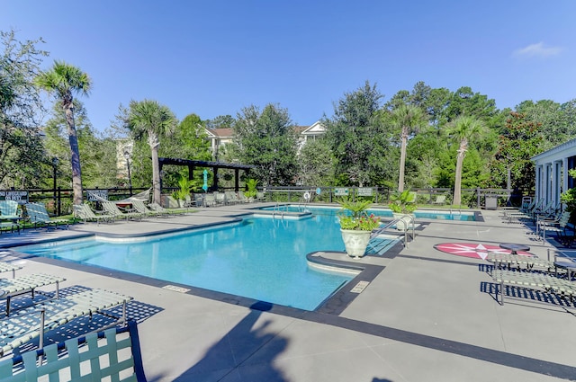 1604 Basildon Rd, Mount Pleasant, SC 29466 - community pool featuring view of wooded area, a hot tub, and a patio area