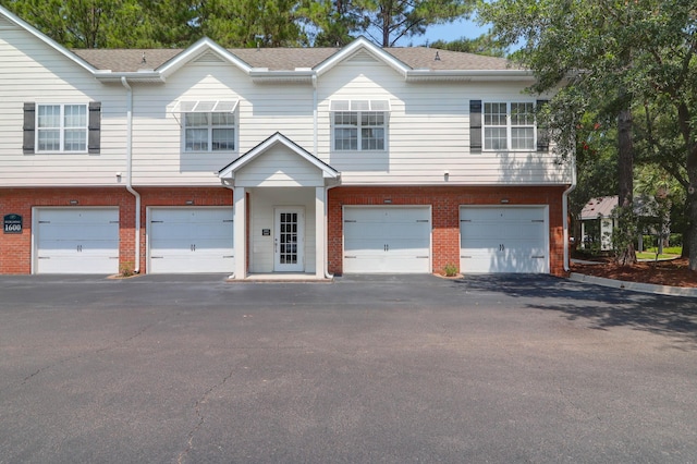 1604 Basildon Rd, Mount Pleasant, SC 29466 - multi unit property featuring brick siding, an attached garage, and driveway
