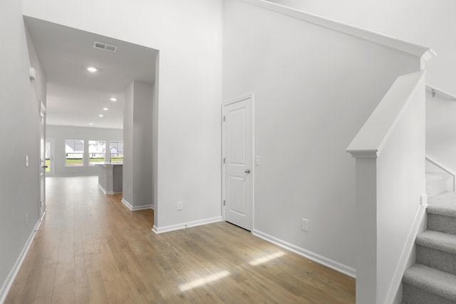 hall with light wood-type flooring