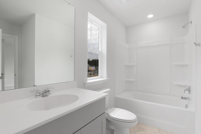 full bathroom with bathing tub / shower combination, vanity, and toilet