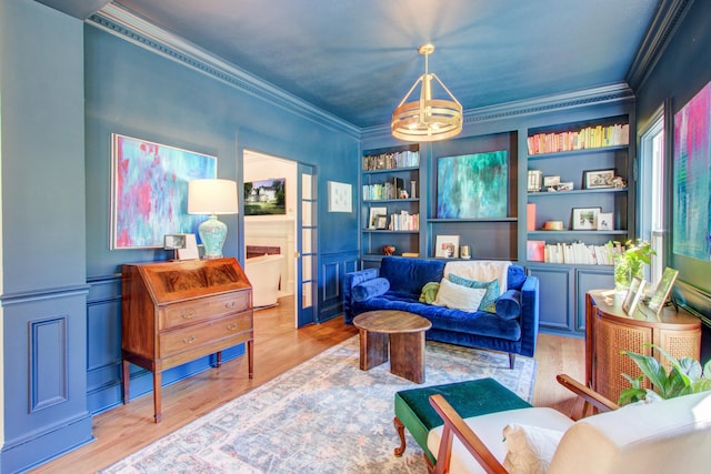 1081 Groves Manor Ct, Mount Pleasant, SC 29464 - living area with crown molding, a chandelier, wood finished floors, and built in shelves
