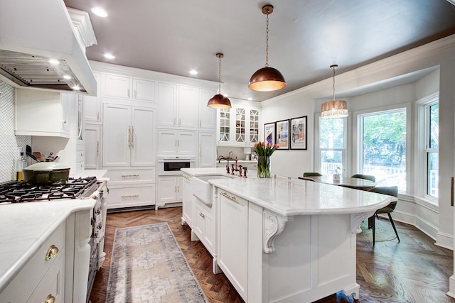 1081 Groves Manor Ct, Mount Pleasant, SC 29464 - kitchen featuring custom range hood, a sink, gas range oven, white cabinetry, and recessed lighting
