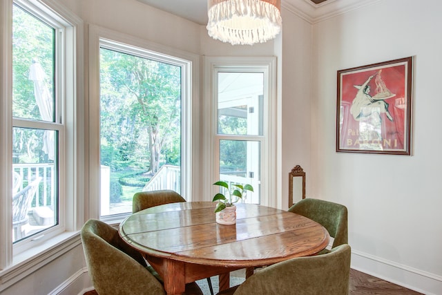1081 Groves Manor Ct, Mount Pleasant, SC 29464 - dining area featuring baseboards, a chandelier, plenty of natural light, and crown molding
