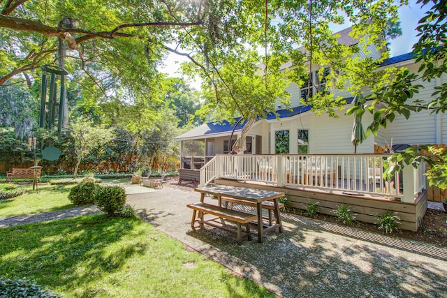 1081 Groves Manor Ct, Mount Pleasant, SC 29464 - view of grassy yard featuring a patio area, a wooden deck, and a sunroom