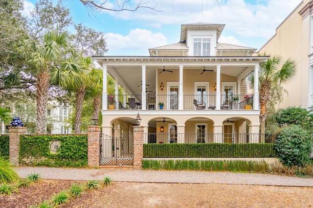 exterior space featuring ceiling fan, covered porch, and a balcony