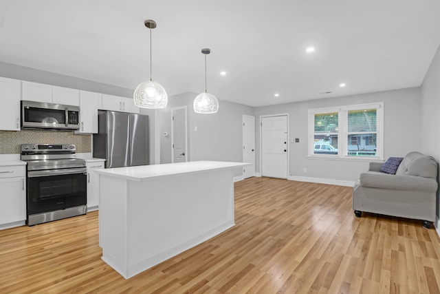 1873 Hazelwood Dr, Charleston, SC 29407 - kitchen featuring open floor plan, light countertops, tasteful backsplash, stainless steel appliances, and white cabinets