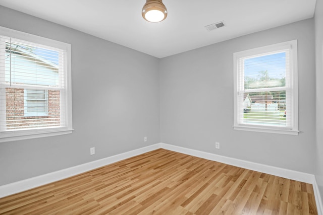 1873 Hazelwood Dr, Charleston, SC 29407 - empty room with baseboards, light wood-style flooring, visible vents, and a healthy amount of sunlight