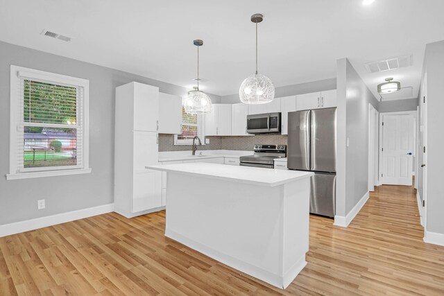 1873 Hazelwood Dr, Charleston, SC 29407 - kitchen featuring visible vents, light countertops, appliances with stainless steel finishes, and tasteful backsplash
