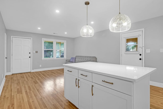 1873 Hazelwood Dr, Charleston, SC 29407 - kitchen featuring light wood finished floors, white cabinetry, light countertops, and a chandelier