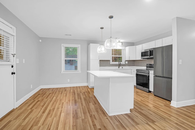 1873 Hazelwood Dr, Charleston, SC 29407 - kitchen with white cabinetry, light countertops, tasteful backsplash, plenty of natural light, and appliances with stainless steel finishes