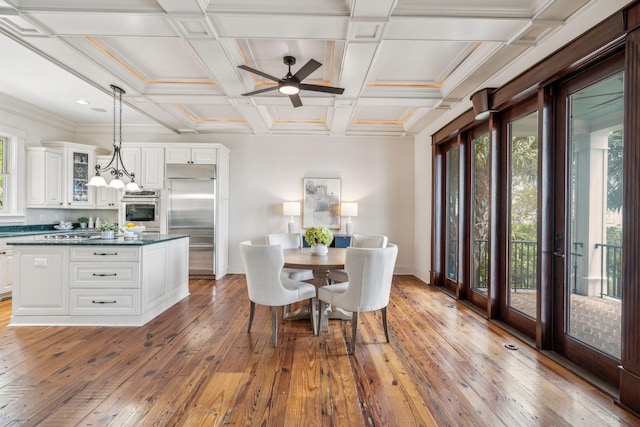 104 Beach St, Mount Pleasant, SC 29464 - dining area featuring plenty of natural light, light wood-style floors, baseboards, ceiling fan, and beamed ceiling