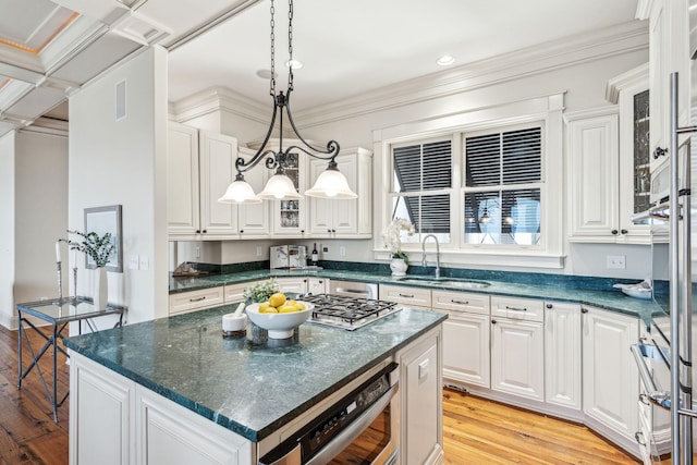 104 Beach St, Mount Pleasant, SC 29464 - kitchen featuring a sink, light wood-type flooring, white cabinetry, crown molding, and recessed lighting