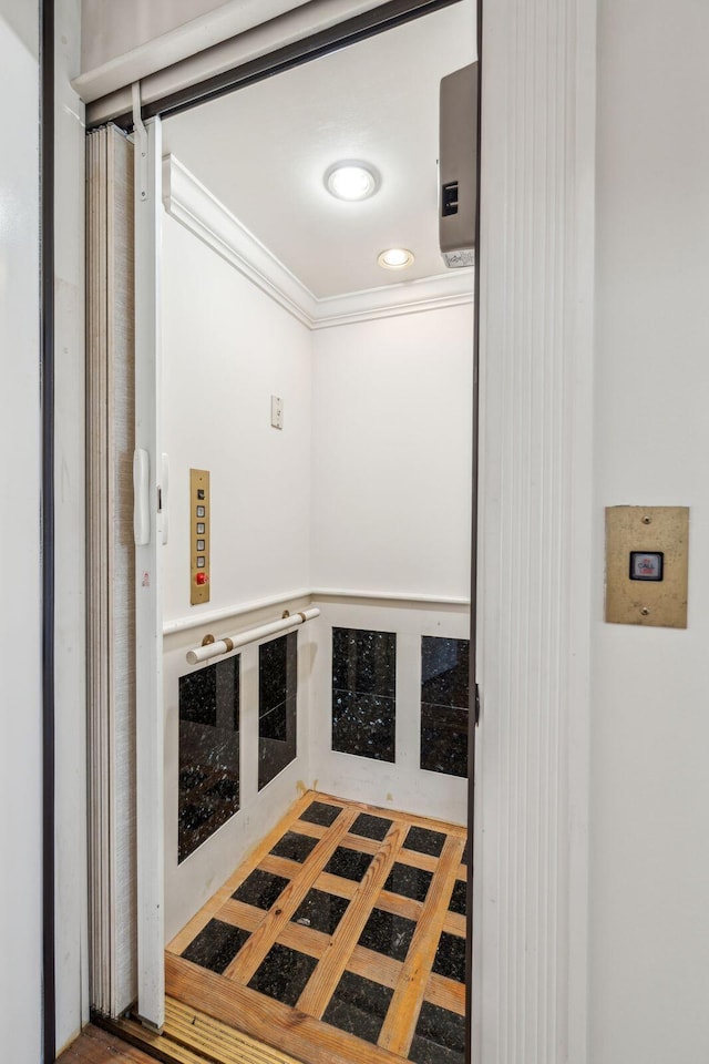104 Beach St, Mount Pleasant, SC 29464 - hall with elevator, ornamental molding, and recessed lighting